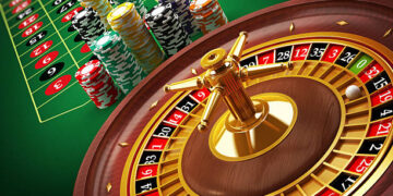 Roulette wheel and casino chips on the table.Similar images: