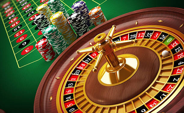 Roulette wheel and casino chips on the table.Similar images: