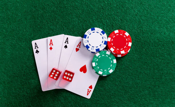 Four aces and gambling chips on the table.